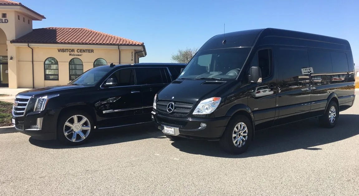 london ontario limo service- two luxury limos are parked in front of house